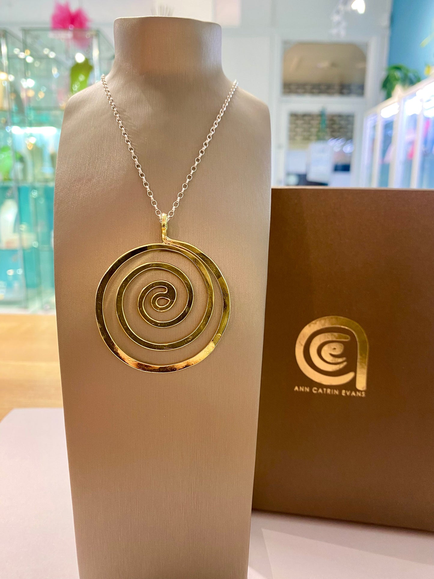Brass swirl pendant