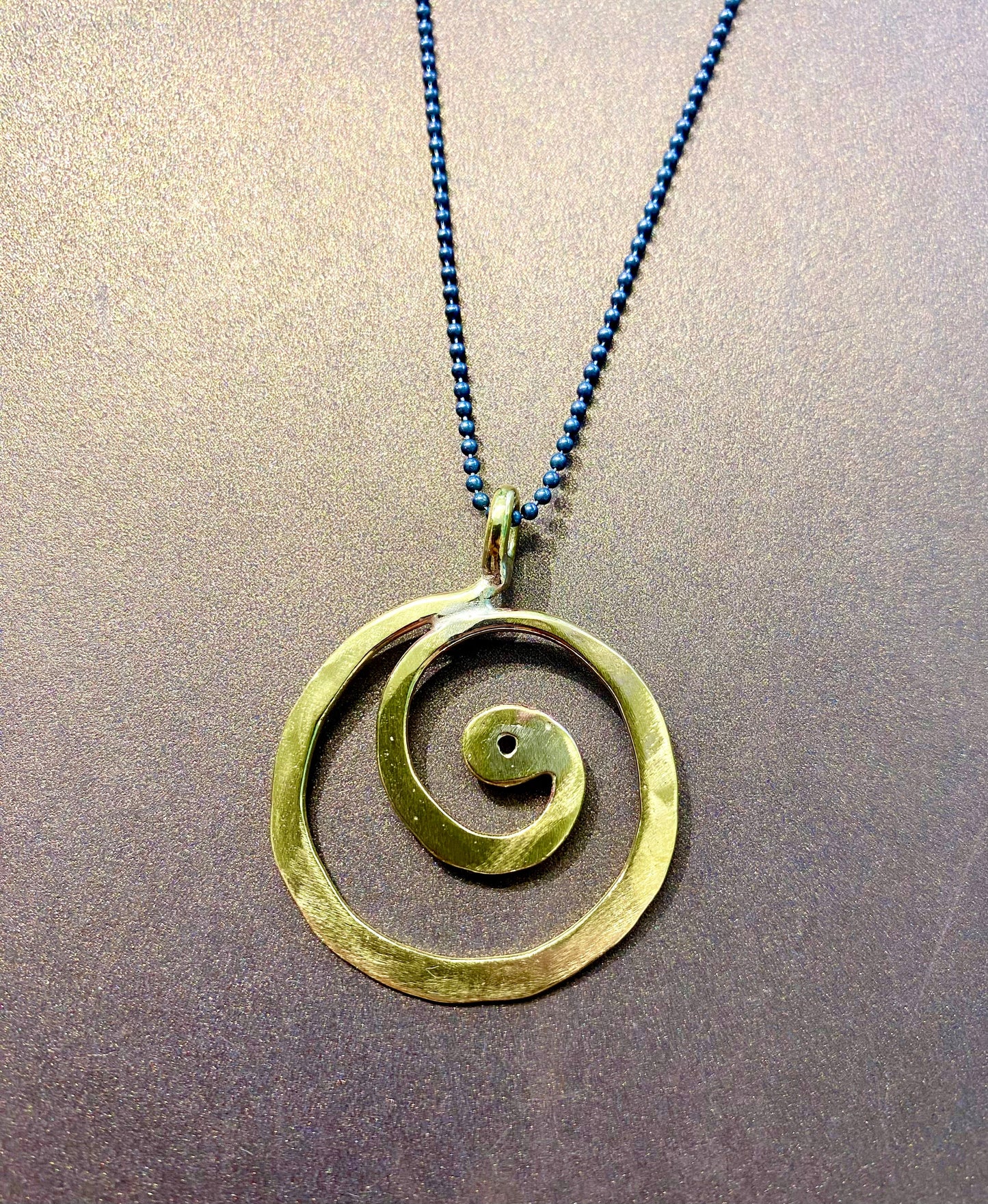 Brass swirl pendant