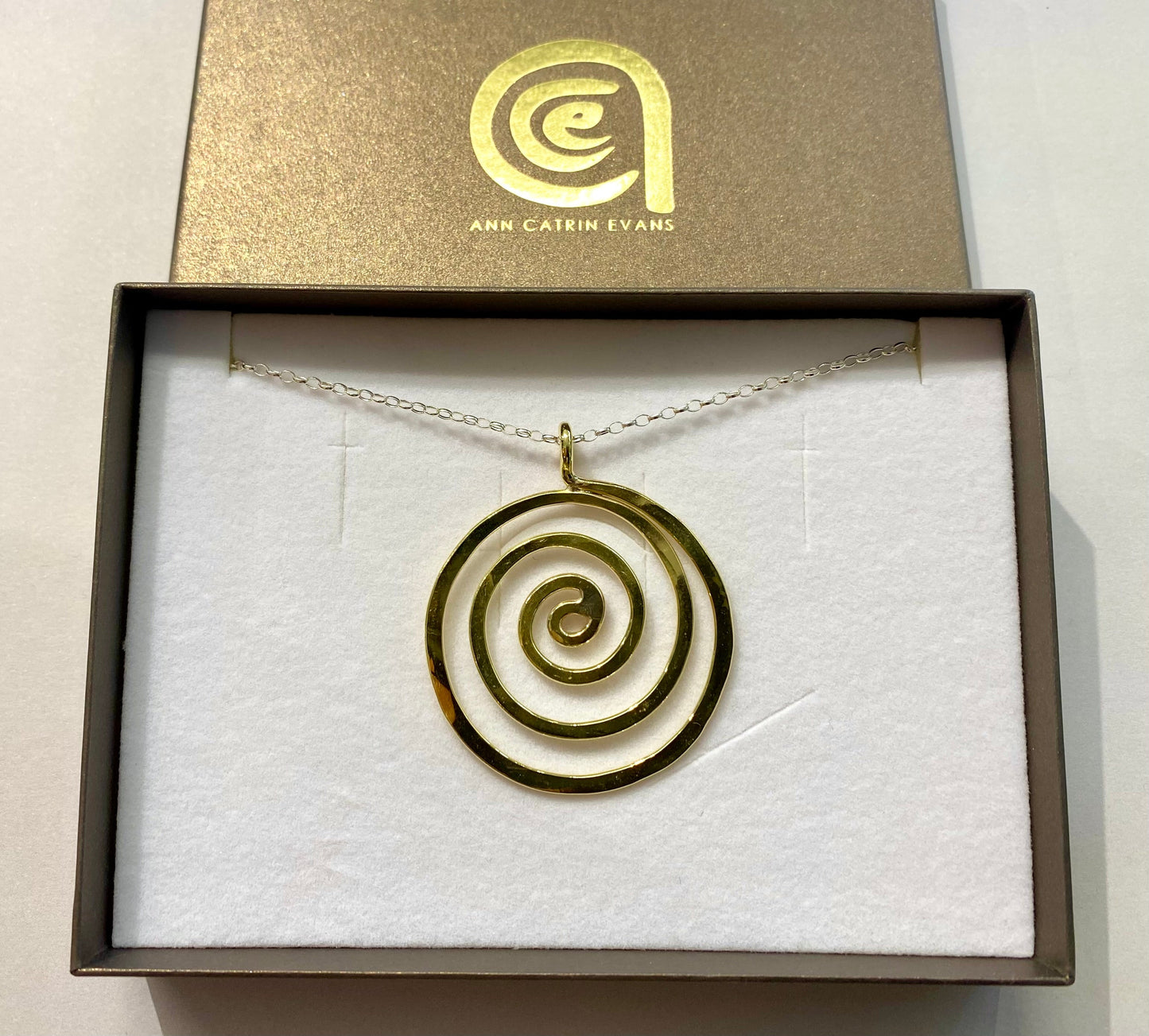 Brass swirl pendant