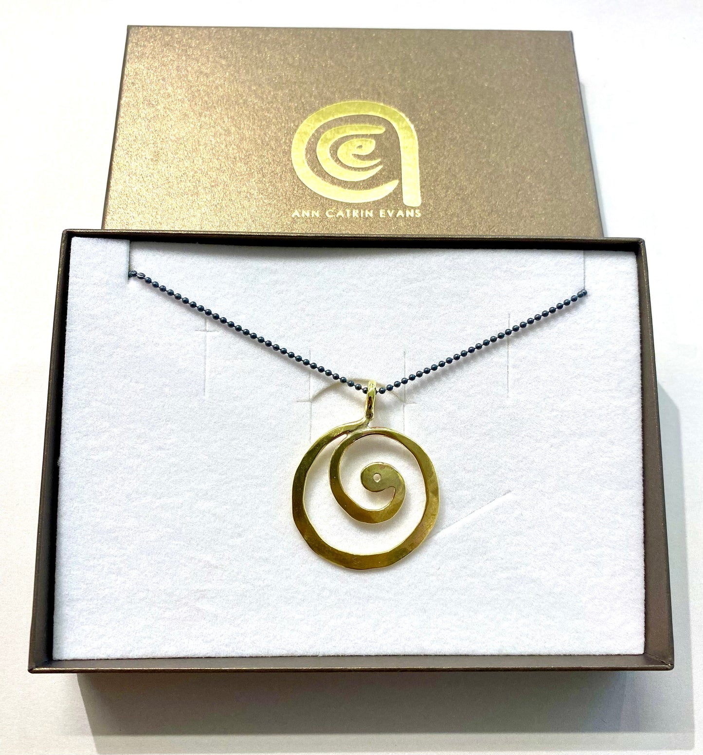 Brass swirl pendant