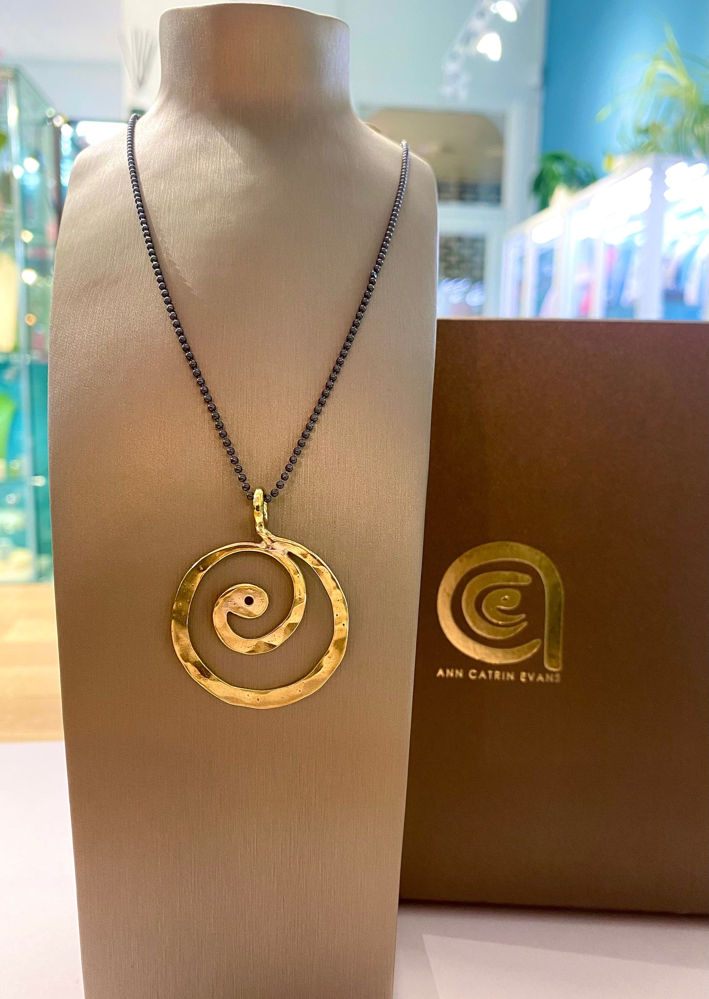 Brass swirl pendant