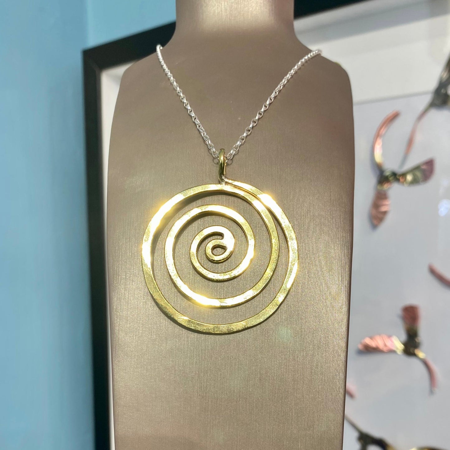 Brass swirl pendant