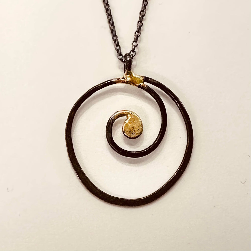 Iron scroll pendant