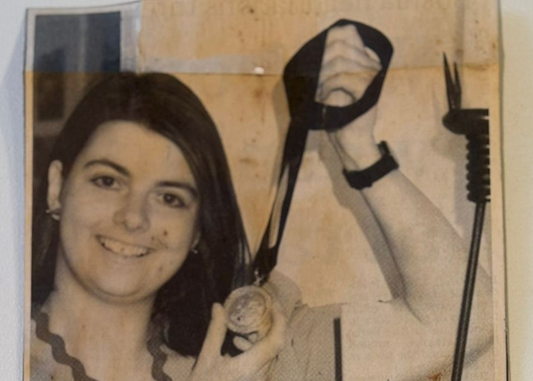 Old newspaper clipping of Ann Catrin Evans with her gold medal